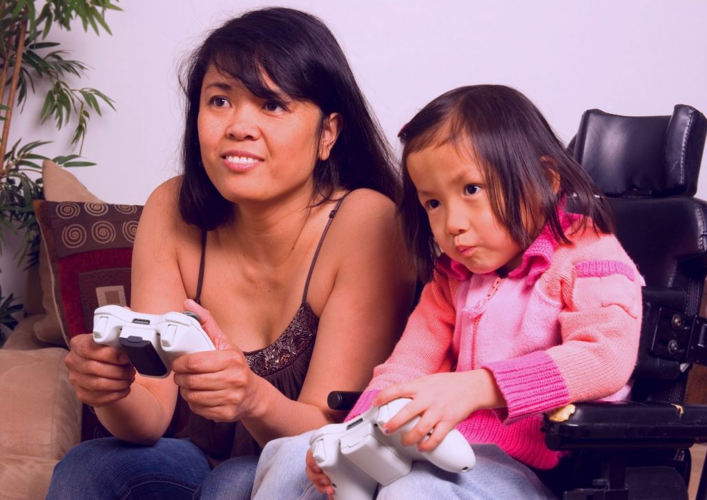 Mother and Daughter playing video games