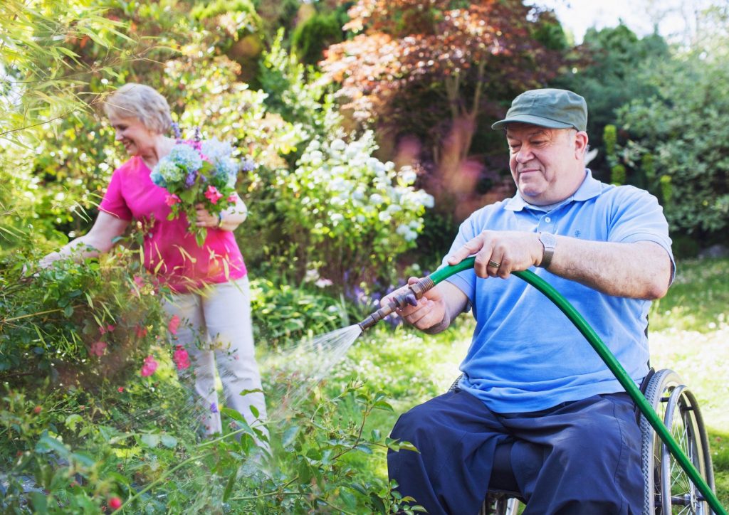 Older Gentleman Gardening with Carer