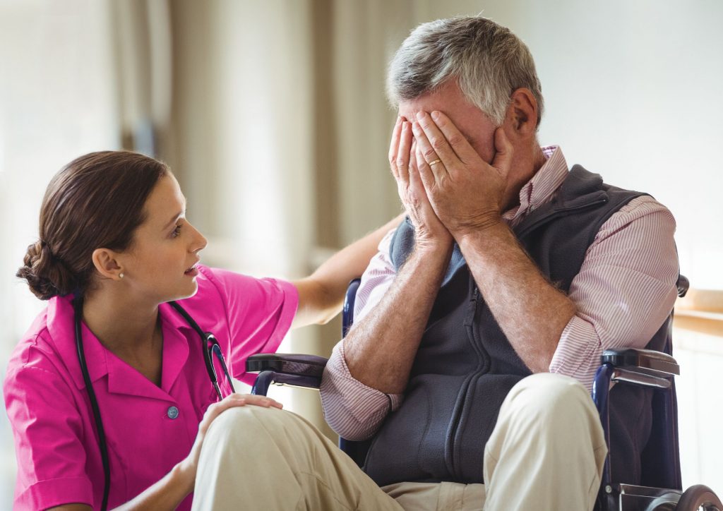 Senior Man crying to Nurse