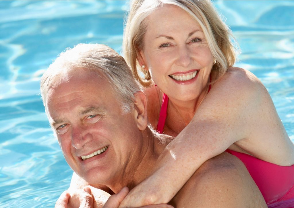 Senior couple hugging and smiling