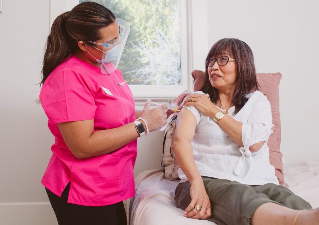 Home Care Nurse Administrating Medication