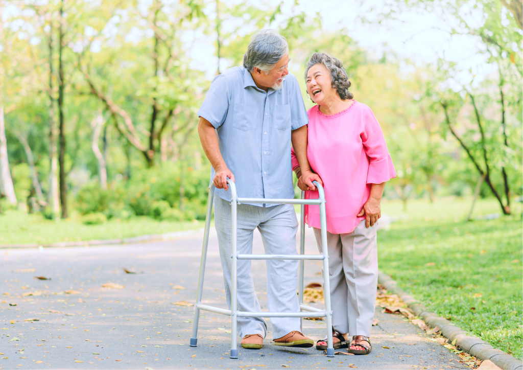 Man with walker walking with his wife 1